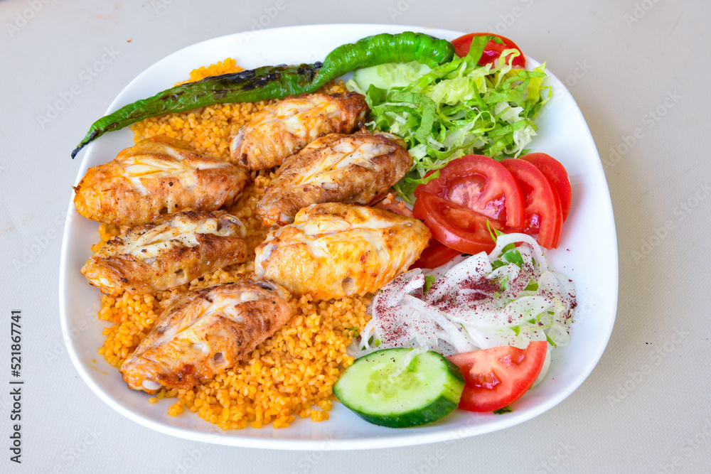 Chicken wings barbeque in a dish with BBQ grill sauce . Izgara tavuk kelebek sis kanat. Tavuk sis, gogus. Chicken wings barbeque in a dish with BBQ grill sauce . Izgara tavuk kelebek sis kanat. Tavuk sis, gogus.