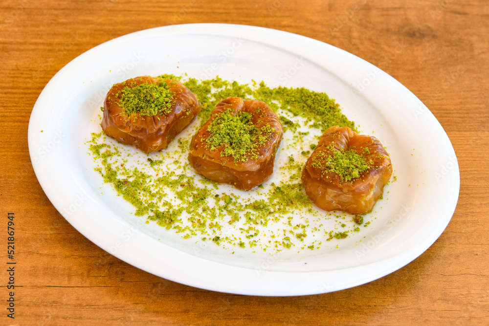 Turkish Dessert Sobiyet , havuc dilimi,  midye  Baklava, mussels baklava and classic baklava with Pistachio . Cevizli, Fistikli Baklava, top view.