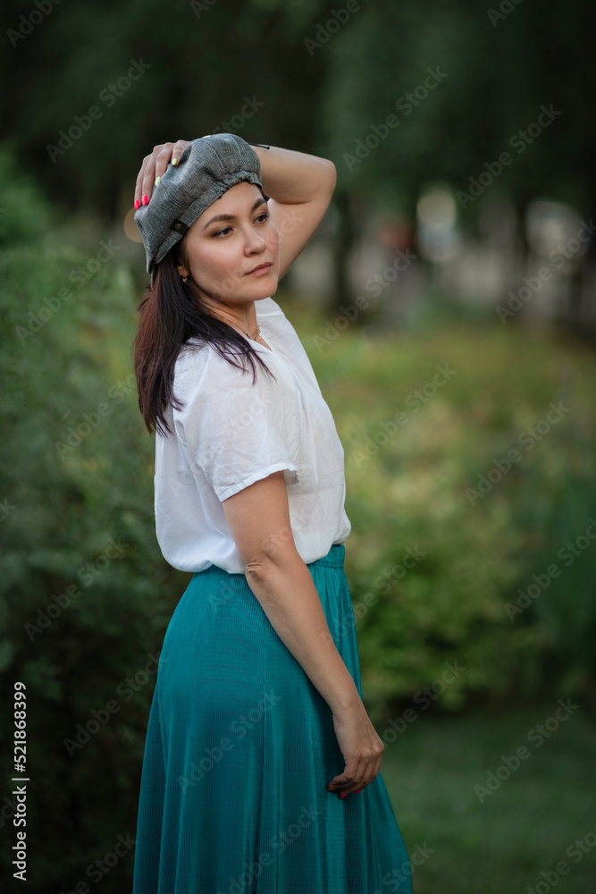 Portrait of a young beautiful dark-haired girl in the park. Close-up, there is artistic noise. Portrait of a young beautiful dark-haired girl in the park. Close-up, there is artistic noise.