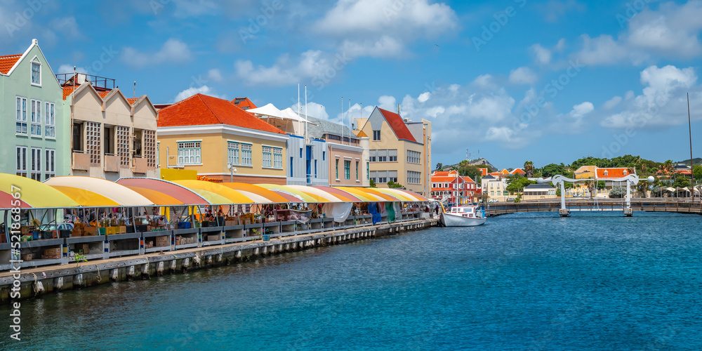 Local market and colorful buildings at the Sha Caprileskade in Punda, Willemstad, Curacao.