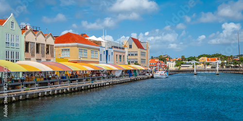 Local market and colorful buildings at the Sha Caprileskade in Punda, Willemstad, Curacao. photo