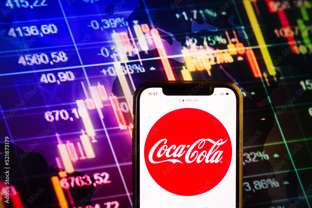 KONSKIE, POLAND - August 07, 2022: Smartphone displaying logo of Coca-Cola  Company on stock exchange chart background Stock Photo