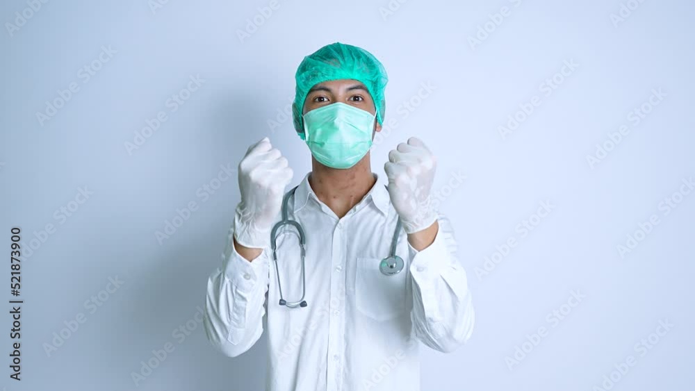 Happy gesture from a young male nurse on a white background Happy gesture from a young male nurse on a white background