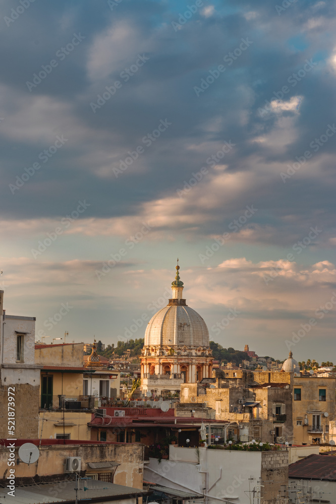 Cupola della basilica Spirito Santo. Napoli city skyline panoramic view from a terrace during sunset