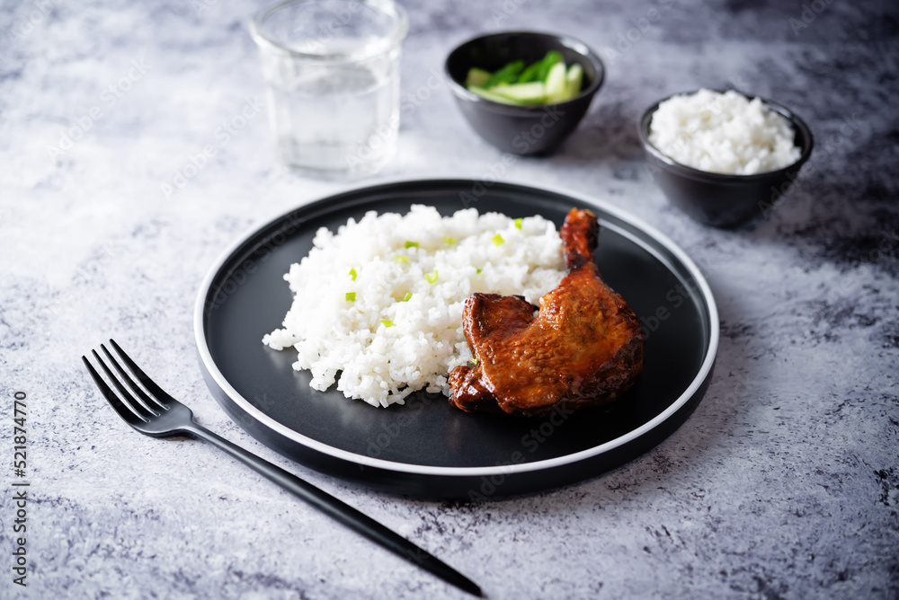 Peking duck with rice on a plate