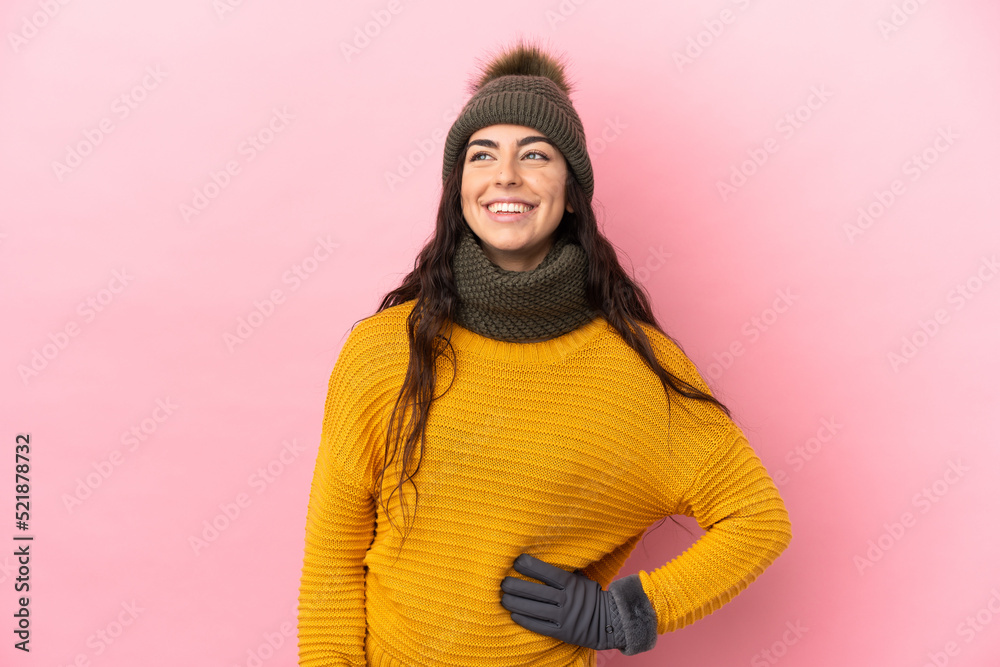 Young caucasian girl with winter hat isolated on purple background thinking an idea while looking up Young caucasian girl with winter hat isolated on purple background thinking an idea while looking up