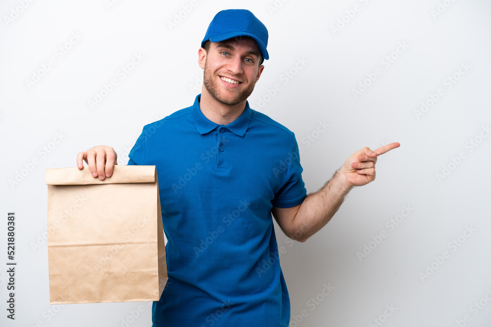 Delivery caucasian man isolated on white background pointing finger to the side Delivery caucasian man isolated on white background pointing finger to the side
