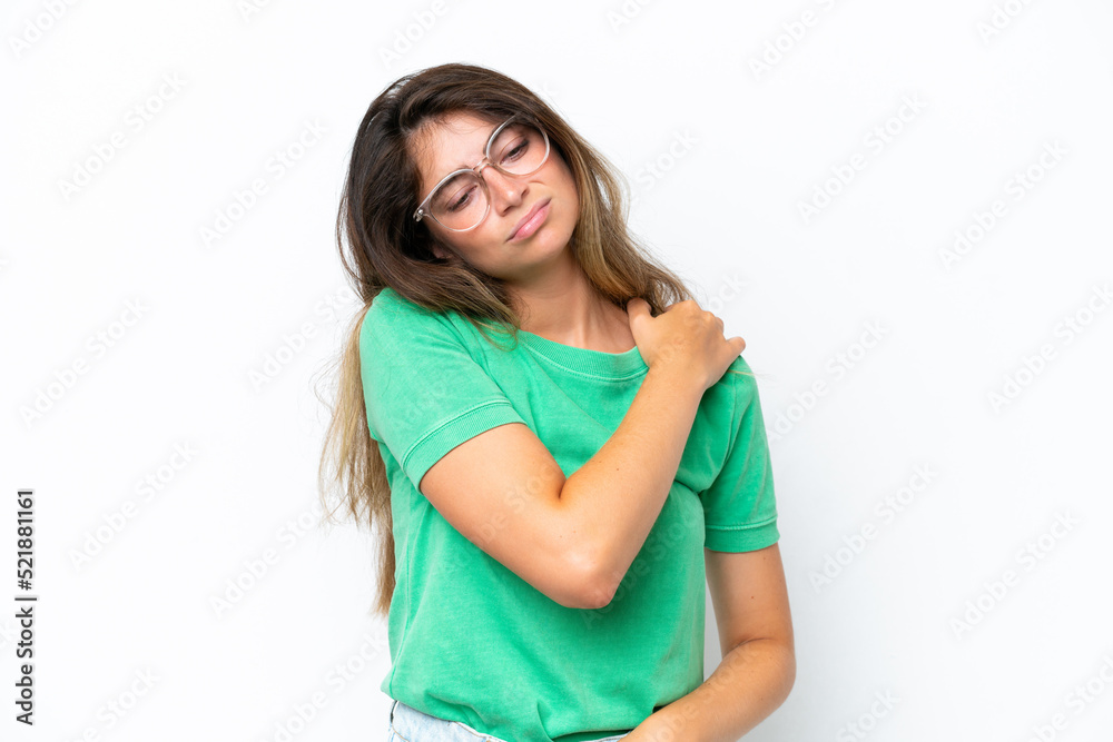 Young caucasian woman isolated on white background suffering from pain in shoulder for having made an effort Young caucasian woman isolated on white background suffering from pain in shoulder for having made an effort