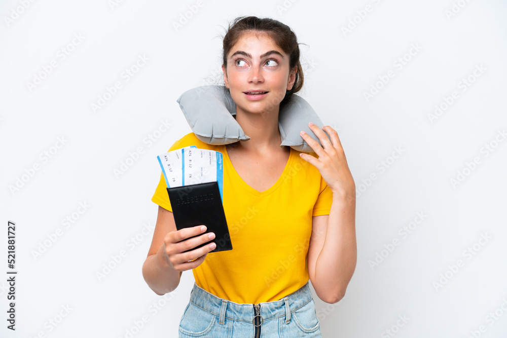Young caucasian woman with Inflatable travel pillow isolated on white background thinking an idea while looking up Young caucasian woman with Inflatable travel pillow isolated on white background thinking an idea while looking up