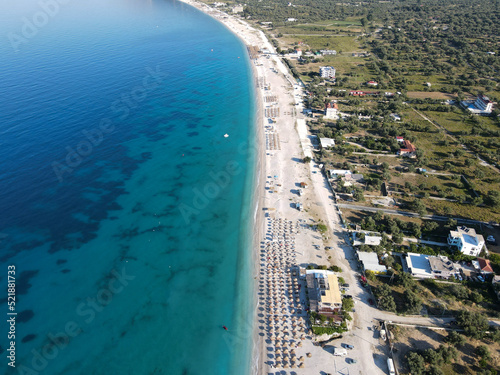 Drone photo of the summer beach resort with umbrellas at the Ionian Sea coast in Albania  Borsch