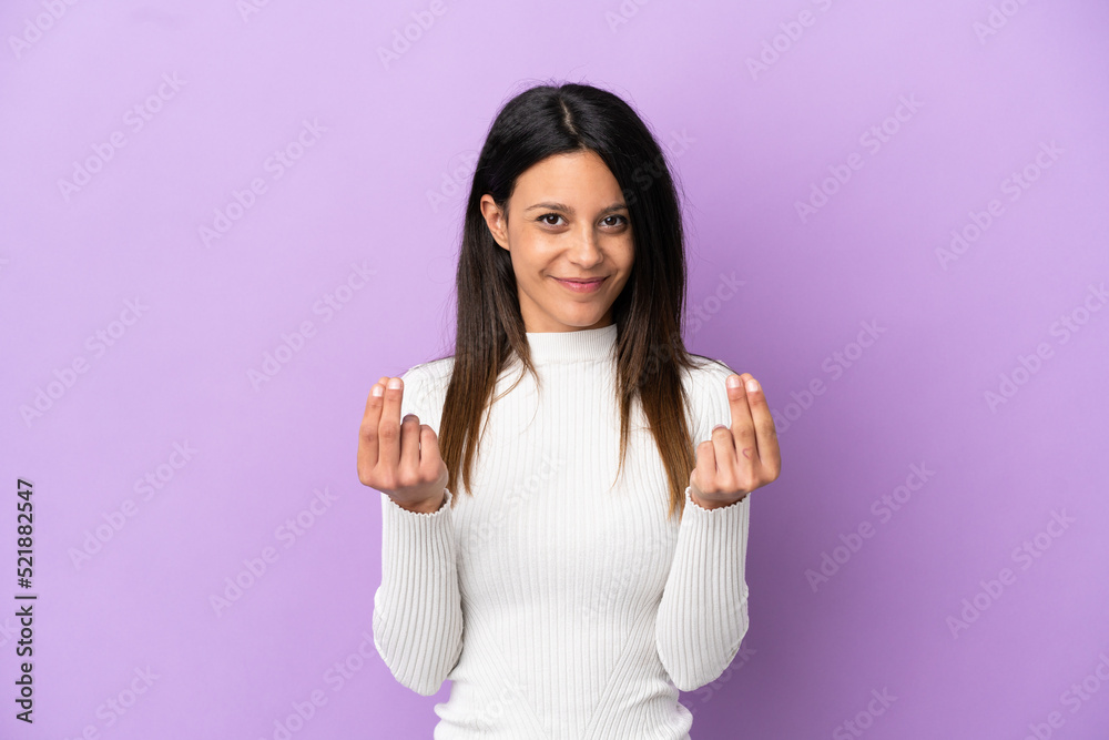 Young caucasian woman isolated on purple background making money gesture Young caucasian woman isolated on purple background making money gesture