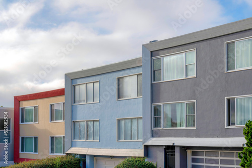 Modern house buildings with reflective picture windows in San Francisco, California