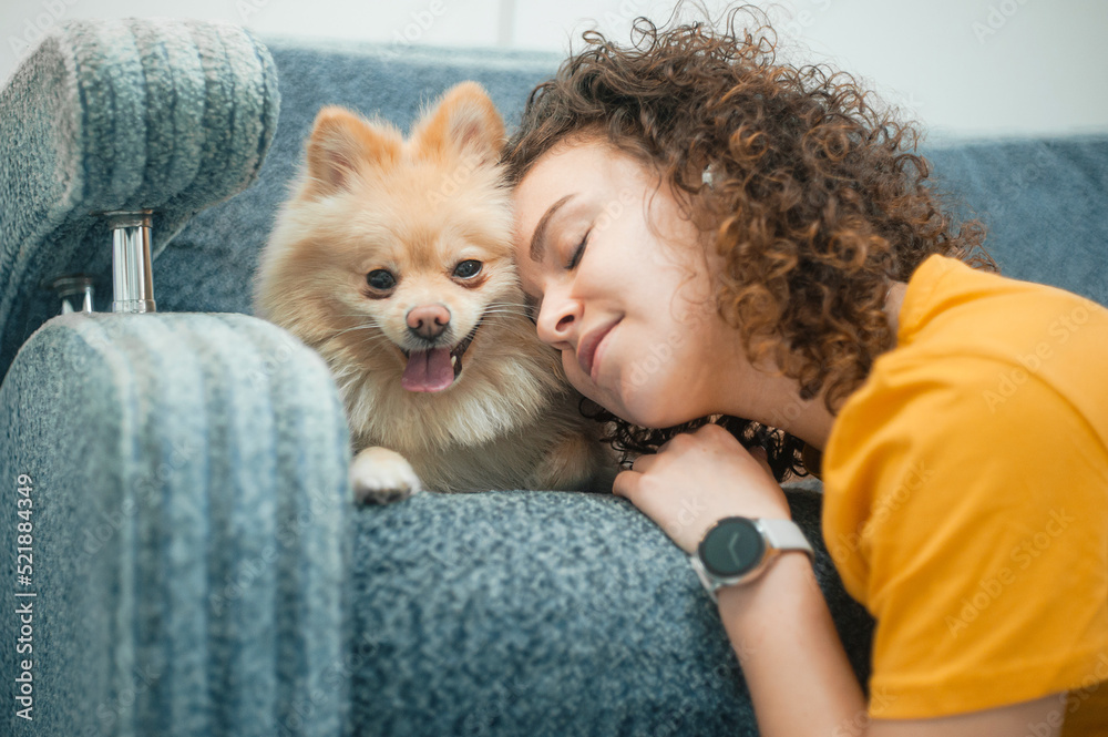 young woman with dog at home, closeup young woman with dog at home, closeup