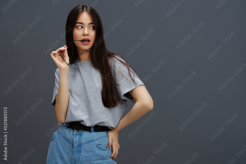 woman in round glasses smile posing close-ups Gray background woman in round glasses smile posing close-ups Gray background