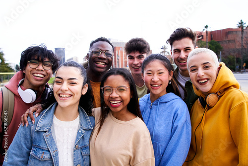 Portrait multiracial group of friends smiling looking at camera. Happy young people having fun