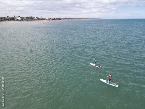 Paddleboarders in the North Sea, off Withernsea photo