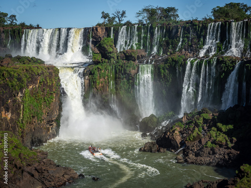Tour boat exploring Iguazu Falls on the border of Brazil and Argentina.