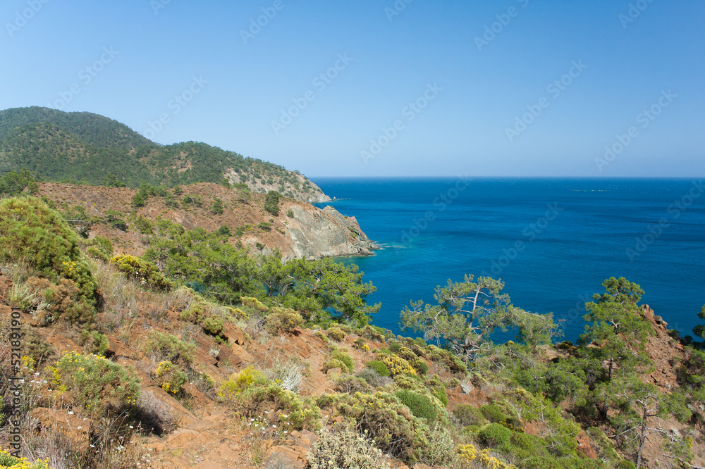 Beautiful seascape. View of bays of Mediterranean Sea and rocky mountains from a hilltop on sunny day in spring. Hike along Lycian Way, Antalya, Kemer, Turkey.