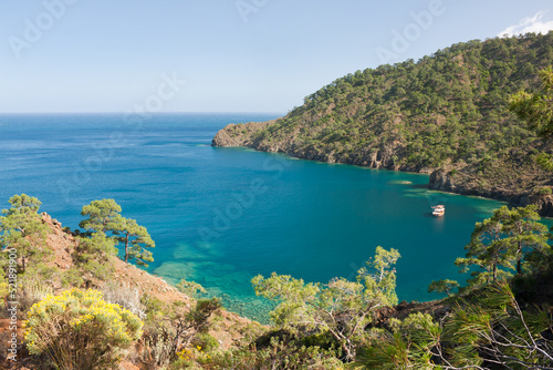 Beautiful seascape. View of bay of Mediterranean Sea on coast of Turkey from a hilltop. Hiking along Lycian Way. Spring, clear cloudless day, calm sea. Antalya, Kemer.