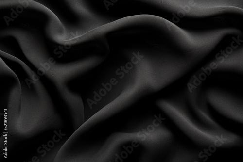 black chiffon fabric draped with large folds, wave textile background