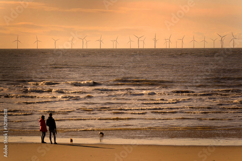 Fototapet An offshore windfarm on the Irish Sea, viewed from the beach at West Kirby, Wirr