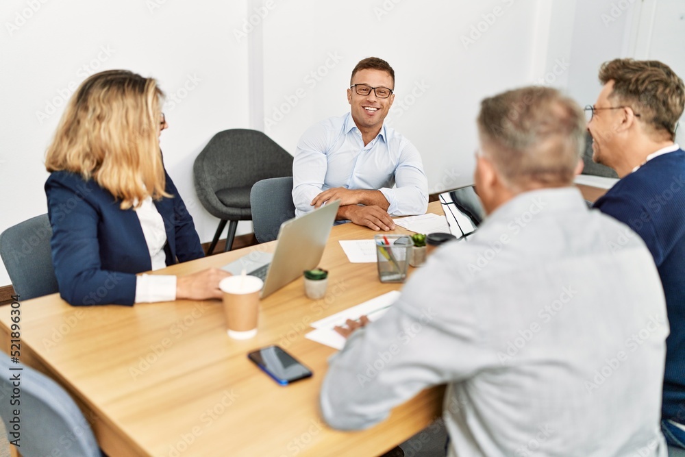 Group of middle age business workers working at the office. Group of middle age business workers working at the office.