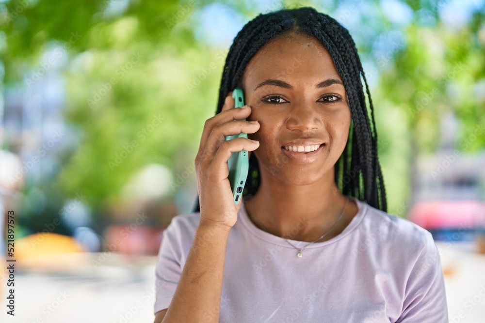 African american woman smiling confident talking on the smartphone at park African american woman smiling confident talking on the smartphone at park