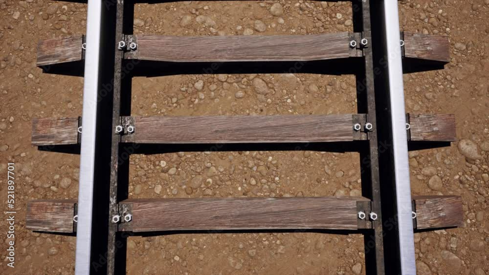 An aerial view over an old rusty railroad track on wooden railway sleepers. An aerial view over an old rusty railroad track on wooden railway sleepers.