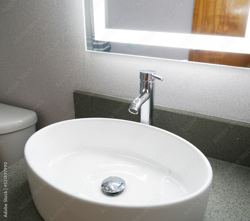 Fototapeta premium close up on ceramic sink in bathroom