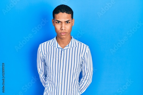 Young african american guy wearing casual clothes skeptic and nervous, frowning upset because of problem. negative person.