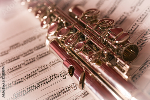 Obraz na płótnie close up of the flute, musical instrument on the music sheet, artistic w salonie