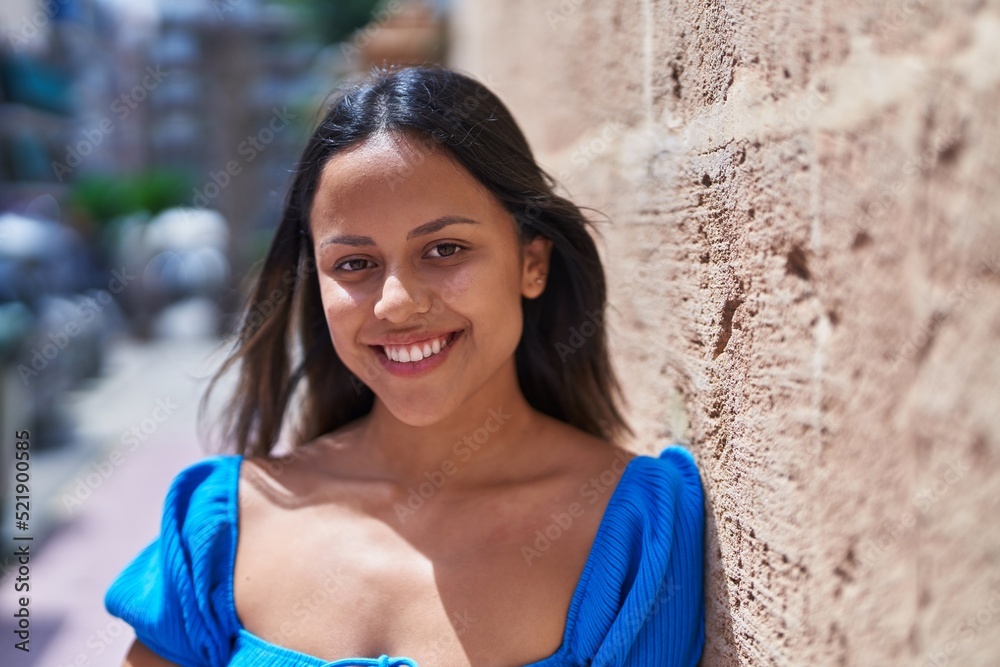 Young hispanic woman smiling confident standing at street Young hispanic woman smiling confident standing at street