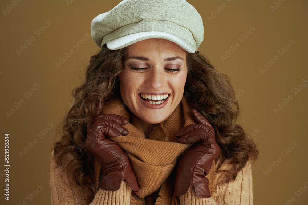 smiling modern woman in scarf isolated on bronze background smiling modern woman in scarf isolated on bronze background