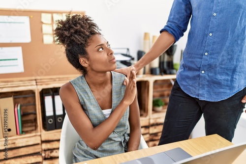 Konstfotografi Man and woman business workers on sexual harassment concept at office