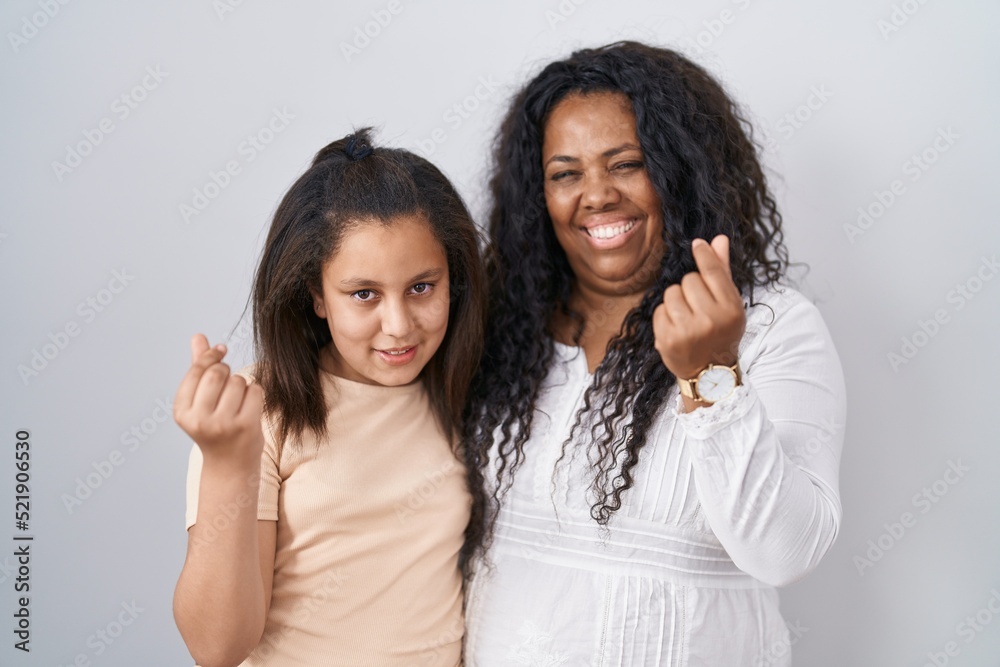 Mother and young daughter standing over white background doing money gesture with hands, asking for salary payment, millionaire business Mother and young daughter standing over white background doing money gesture with hands, asking for salary payment, millionaire business