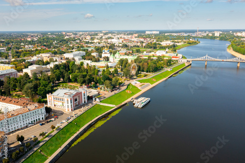 Picturesque summer landscape of Russian city of Tver overlooking two bridges across Volga river on sunny day ..