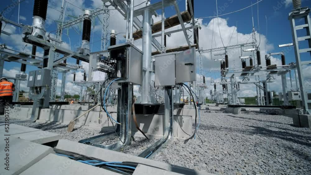 Many high voltage electrical insulators in power substation against ...