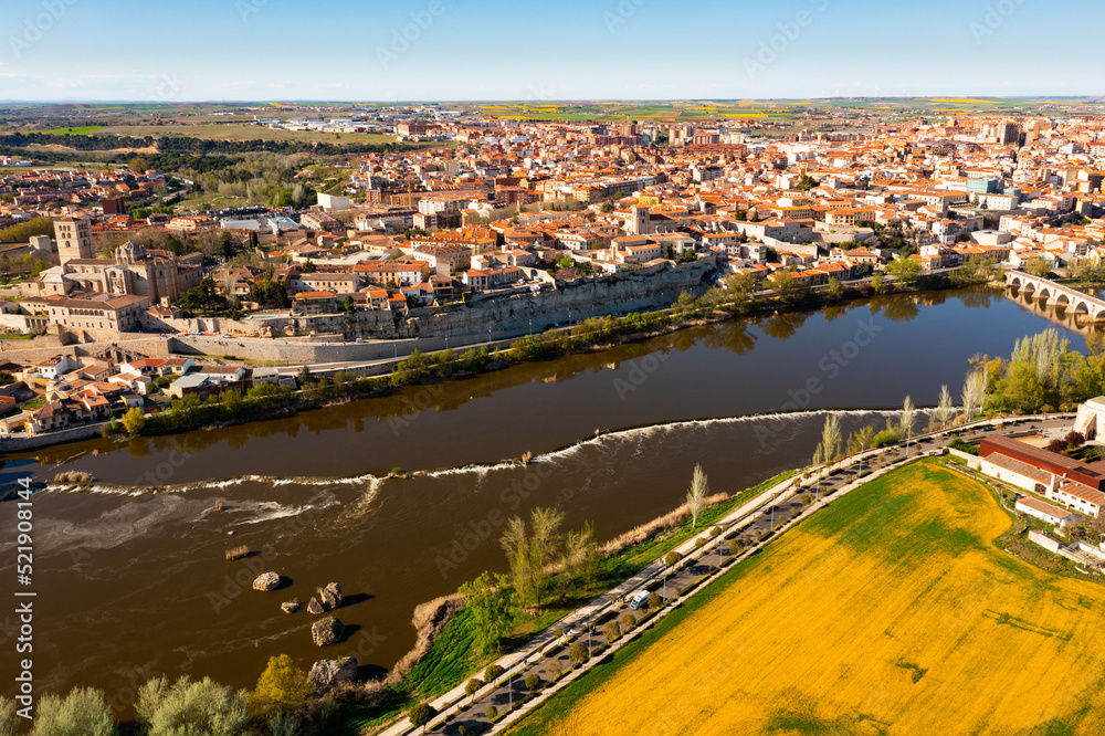 Drone photo of Dureo riverside, residential buildings along river. Castile and Leon, Spain.
