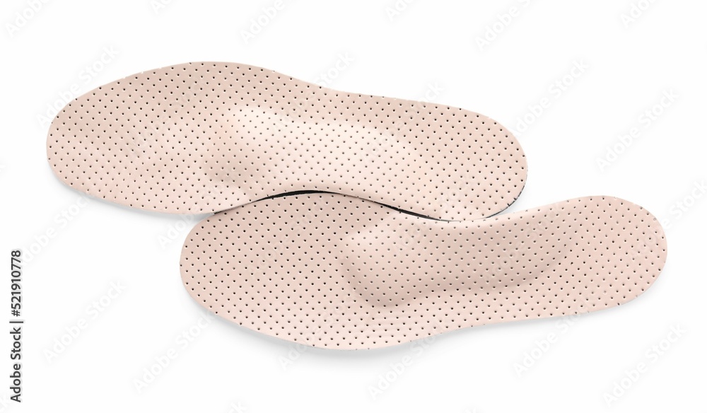 Beige orthopedic insoles isolated on white, top view Beige orthopedic insoles isolated on white, top view