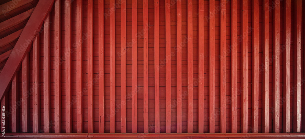 The red background wall made of dark red wood products in ancient Chinese style The red background wall made of dark red wood products in ancient Chinese style