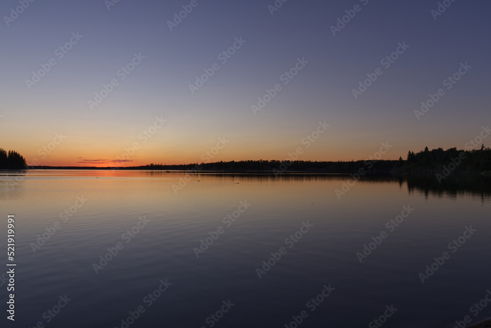 Naklejka premium Sunset at Astotin Lake in Elk Island National Park