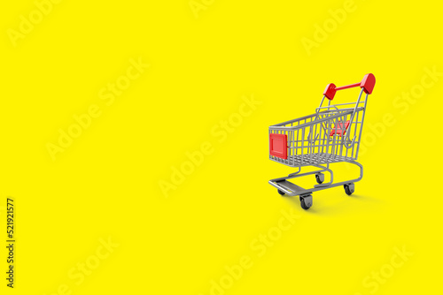 Shopping cart isolated on yellow background and space for content creators