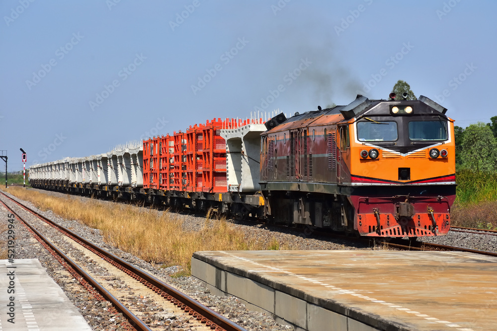 Freight train by diesel locomotive on the railway