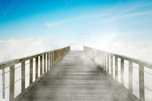 Eempty wooden bridge with blue sky background