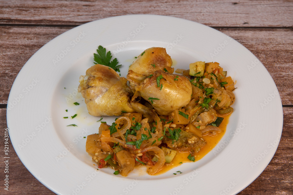 Delicious chicken with oven-roasted ratatouille vegetables. High quality photo Delicious chicken with oven-roasted ratatouille vegetables. High quality photo