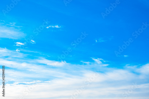 White spindrift clouds moving fast in light blue sky. Cloudscape. Nature background. Windy weather forecast. Religion concept. Heaven landscape. Fresh air. Morning inspiration