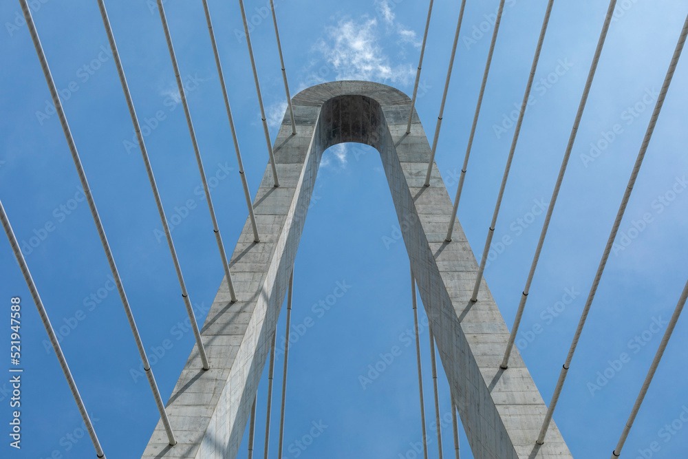 Naklejka premium Detail with Blue sky of Thu Thiem Two Bridge crossing the Saigon River in Ho Chi Minh City. It is the newest bridge in the economic capital.