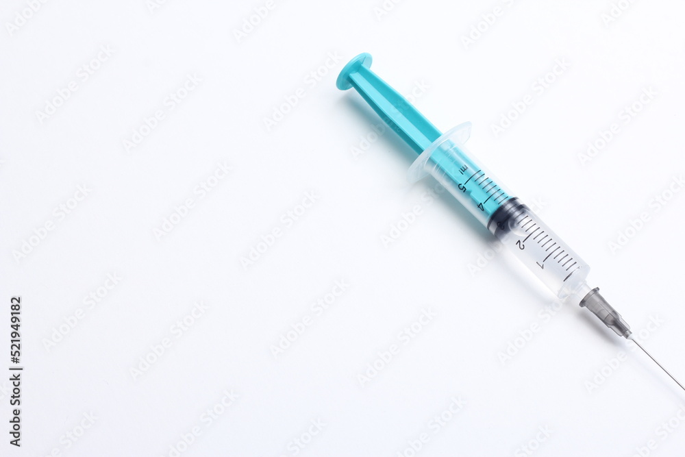 Medical syringe on a white background. A syringe for injection. The concept of health and beauty Medical syringe on a white background. A syringe for injection. The concept of health and beauty