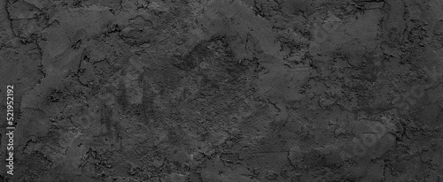 Black or dark gray rough soil-like texture background © Mr. Music