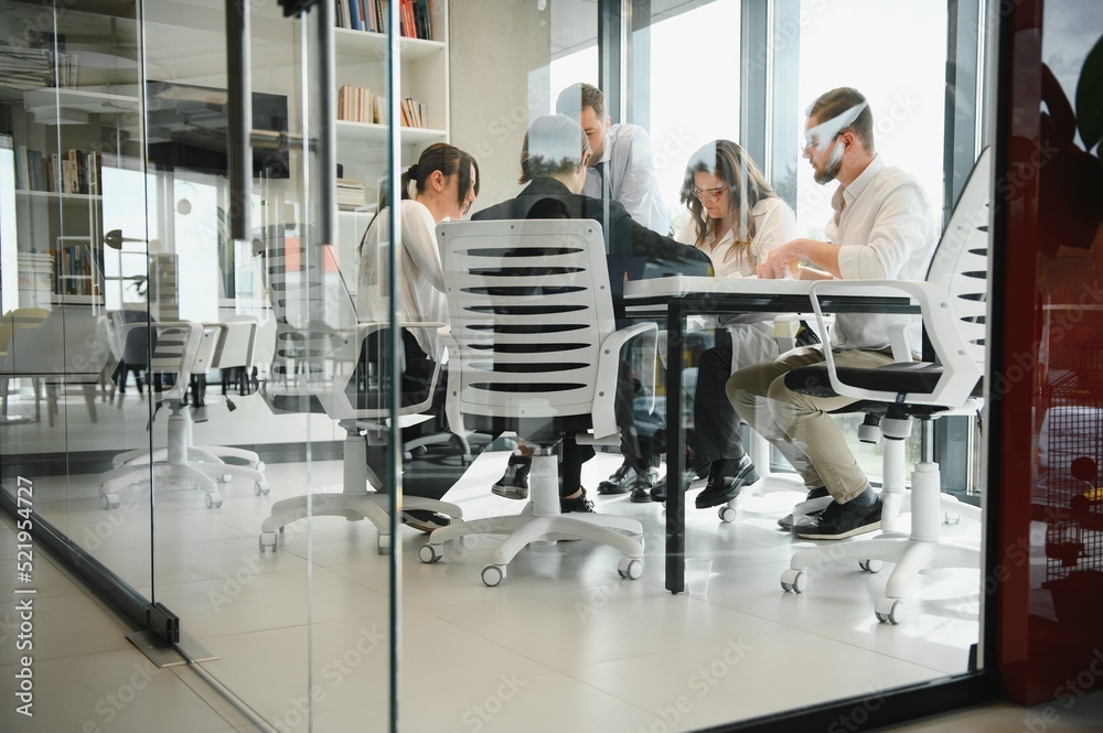 A group of business people partners during a set team meeting in the modern office. Teamwork concept